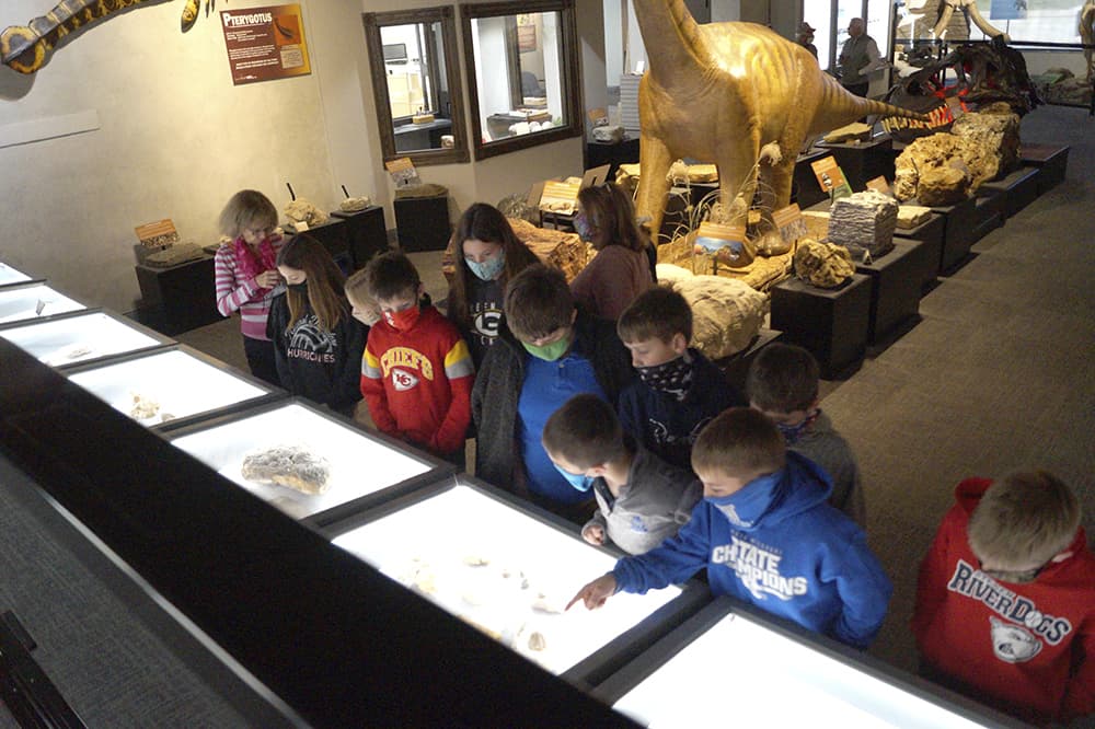 lots of children in the museum